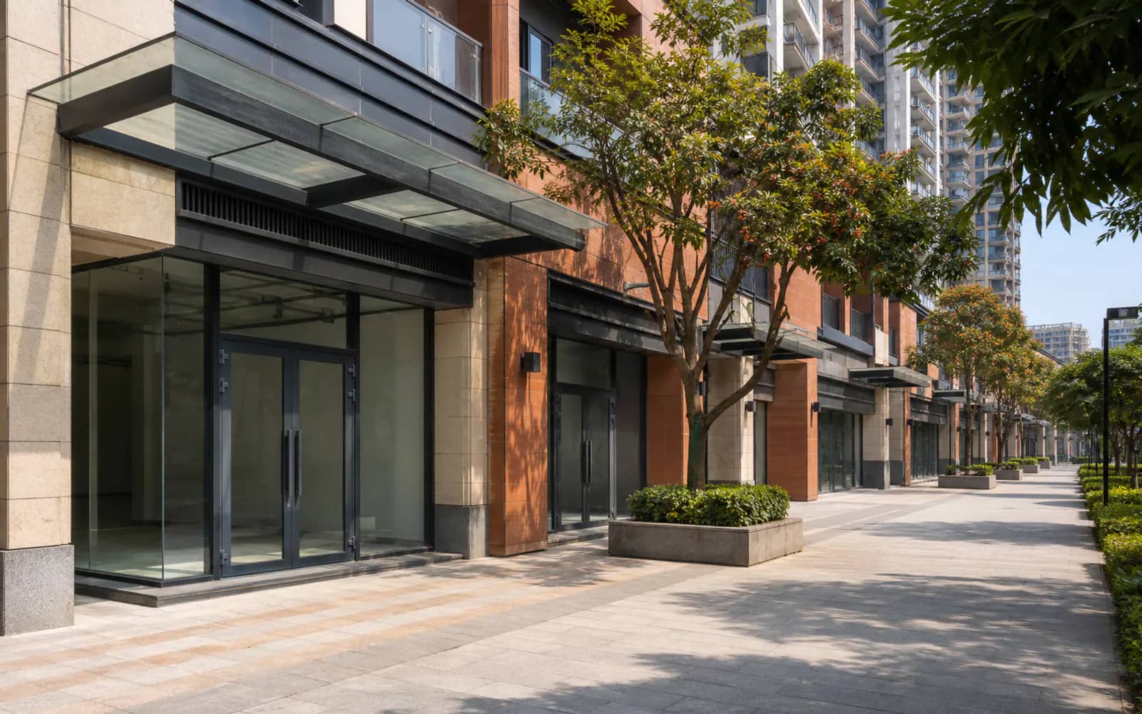 Contemporary open-air high-street retail frontage in a planned Noida district